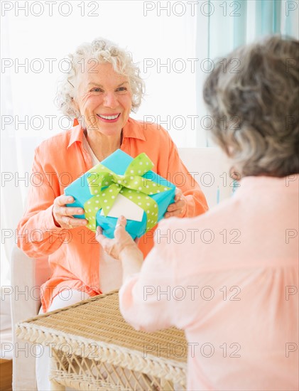 Two senior women celebrating birthday. Photo : Daniel Grill