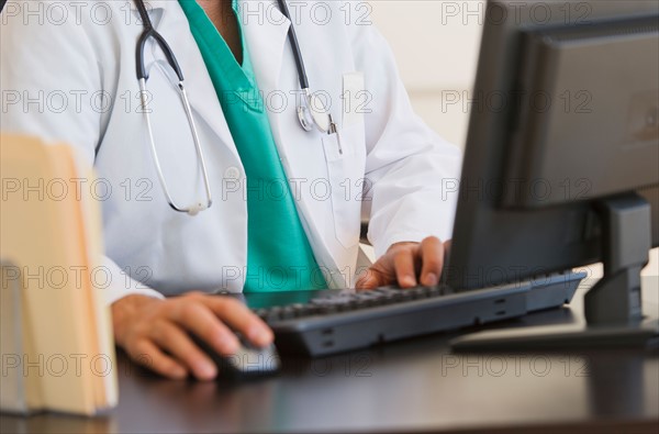 Doctor using computer.