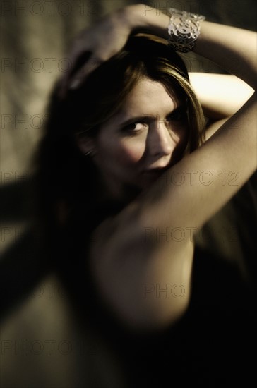 Studio portrait of woman with long hair.