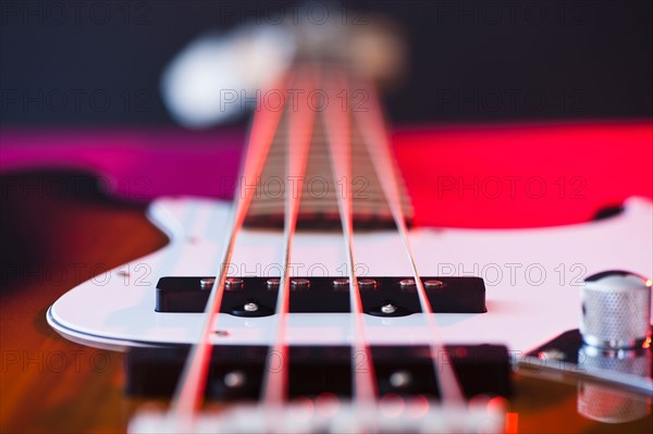 Close up of bass guitar. Photo : Daniel Grill