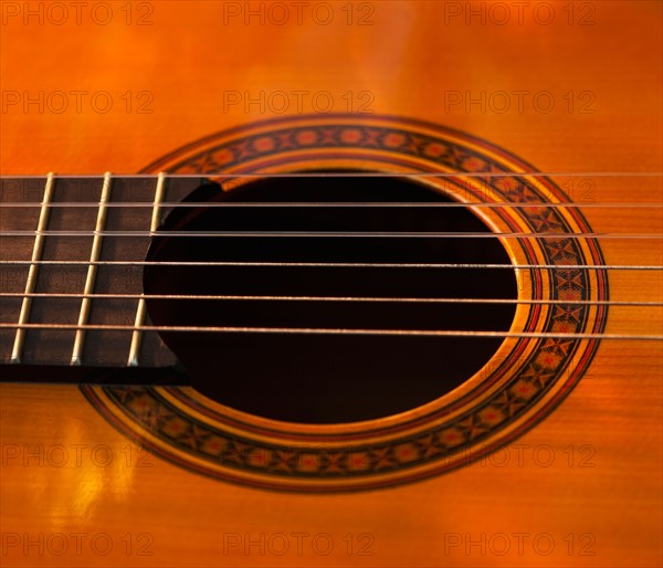 Close up of sound hole of acoustic guitar. Photo: Daniel Grill