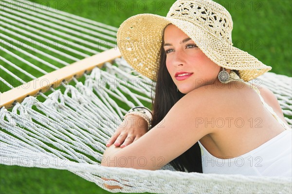 Woman relaxing in hammock.