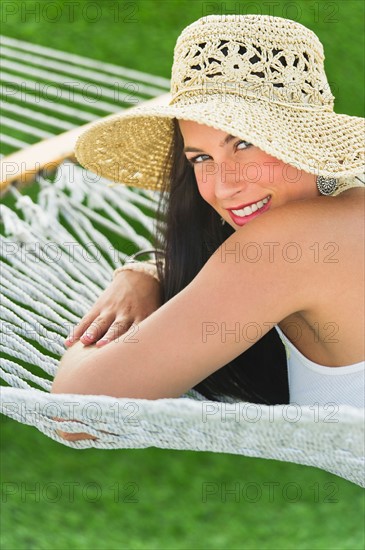 Woman relaxing in hammock.