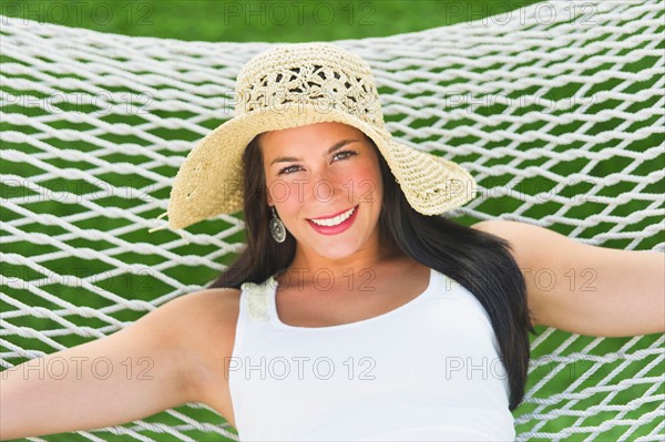 Woman relaxing in hammock.