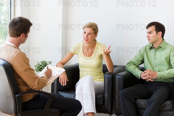 Couple discussing issues during therapy.