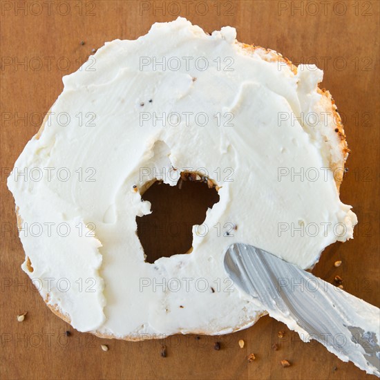 Close up of bagel with cream cheese. Photo : Jamie Grill