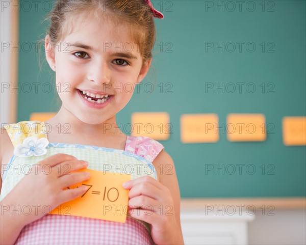 Portrait of smiling schoolgirl ( 6-7). Photo : Jamie Grill