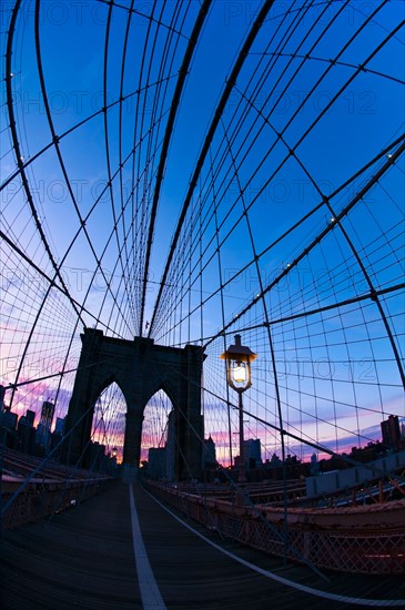 USA, New York State, New York City, Manhattan, Brooklyn Bridge at dusk. Photo: Daniel Grill
