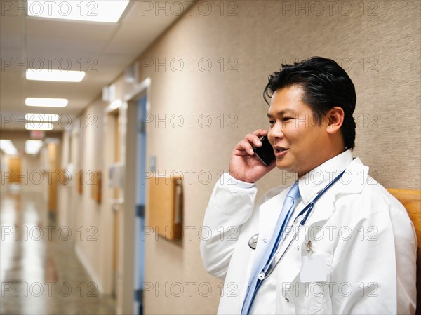 Portrait of doctor talking on mobile phone. Photo: Erik Isakson
