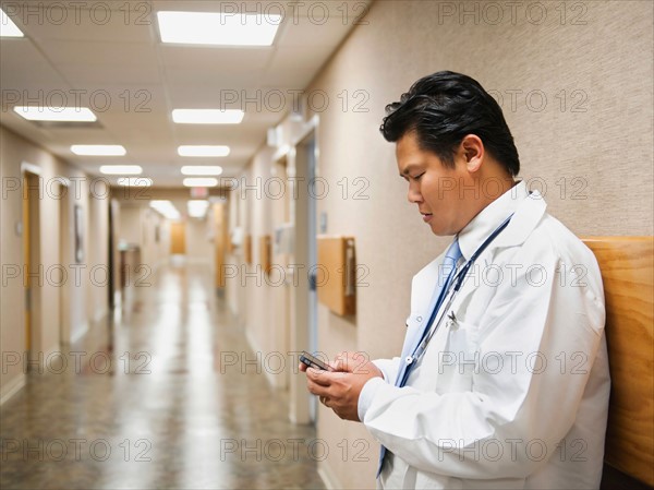 Portrait of doctor with mobile phone.