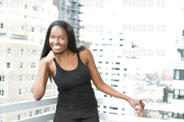 Portrait of young woman on balcony. Photo : Pauline St.Denis