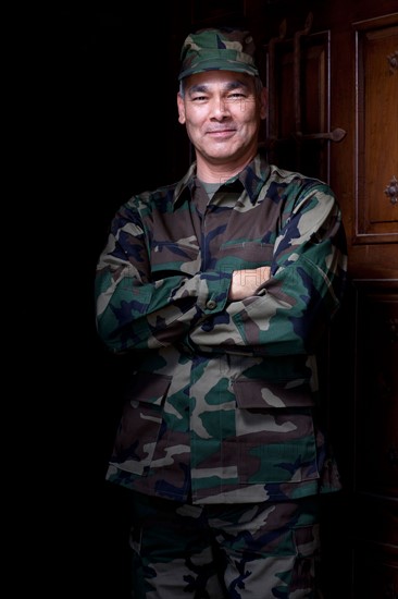 Portrait of mature man wearing military uniform. Photo: db2stock