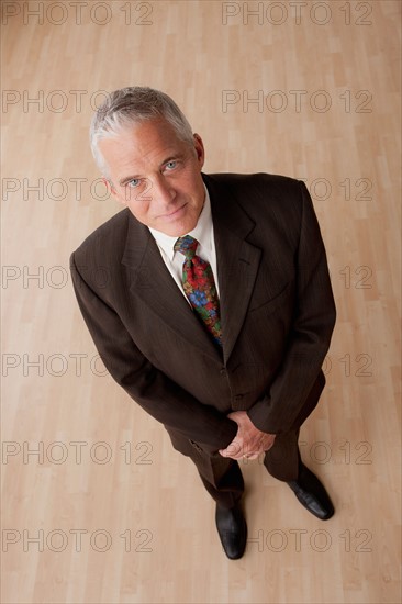 Portrait of smiling senior businessman. Photo : Rob Lewine