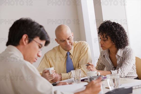 People discussing at business meeting. Photo : Rob Lewine