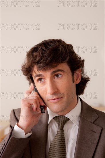 Businessman talking on phone. Photo: Rob Lewine