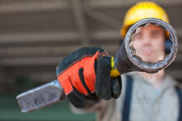 Portrait of male manual worker holding tool. Photo : db2stock