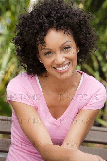 Portrait of young woman smiling. Photo : Rob Lewine
