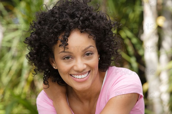 Portrait of young woman smiling. Photo : Rob Lewine