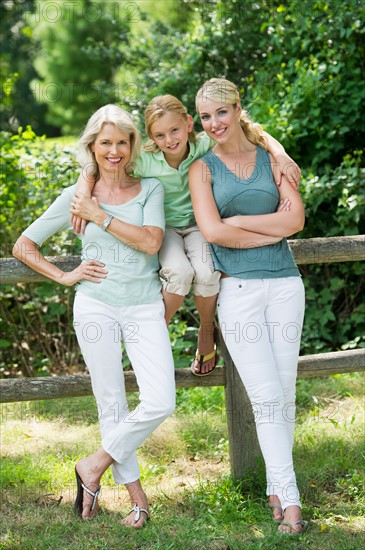 Portrait of girl (10-11) with mother and grandmother.