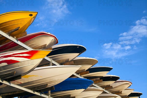 Boats stacked on rack. Photo : John Kelly