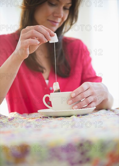 Woman preparing tea. Photo: Jamie Grill
