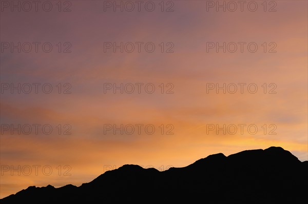 USA, California, Silhouette of ridge at sunset. Photo: Gary J Weathers