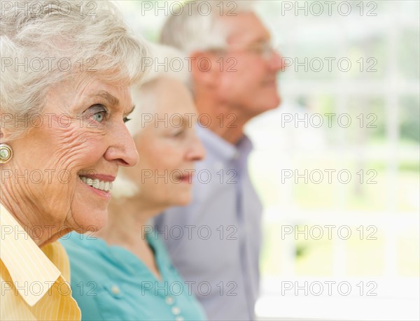 Profiles of senior women and senior man.