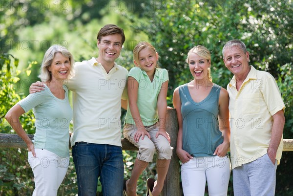 Portrait of girl (10-11) with parents and grandparents.