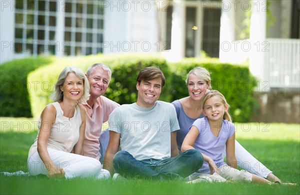 Portrait of girl (10-11) with parents and grandparents.