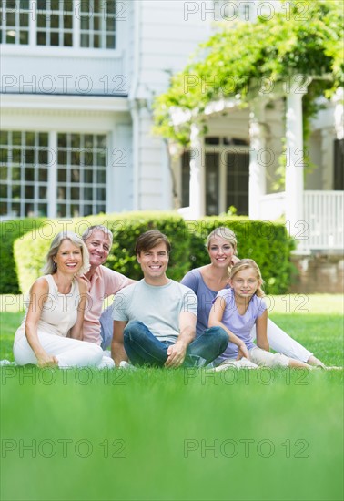 Portrait of girl (10-11) with parents and grandparents.