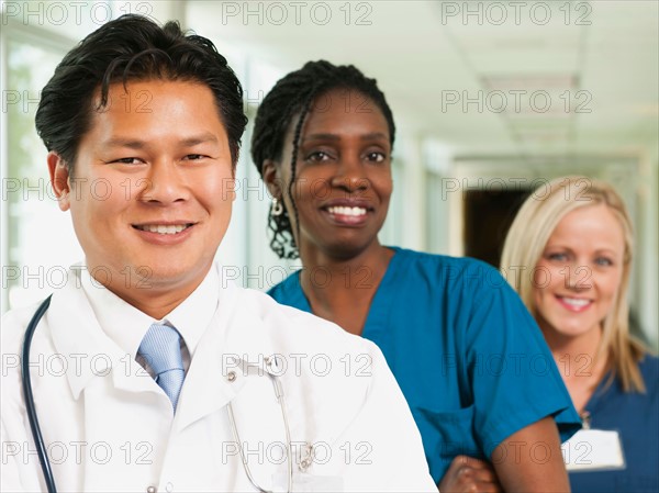 Doctor and two nurses posing for portrait.