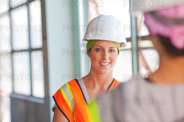Two female manual workers. Photo: db2stock
