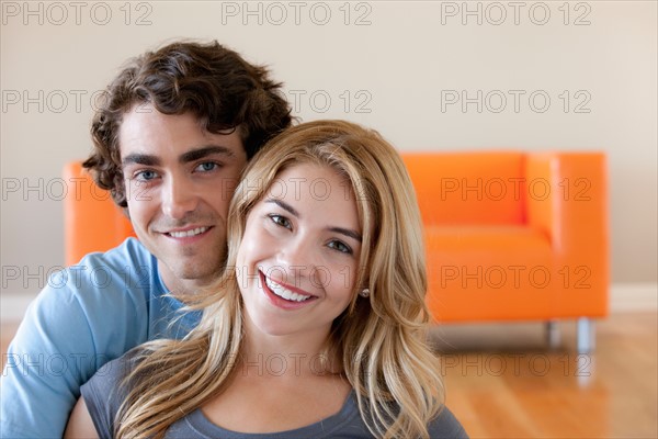 Portrait of young couple in room. Photo: Rob Lewine