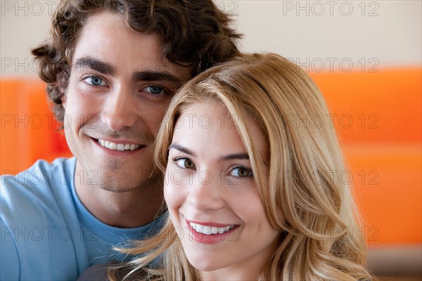 Portrait of young couple in room. Photo: Rob Lewine