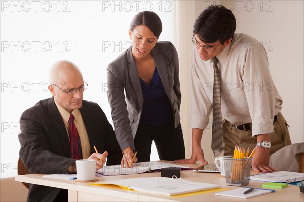 People discussing at business meeting. Photo: Rob Lewine