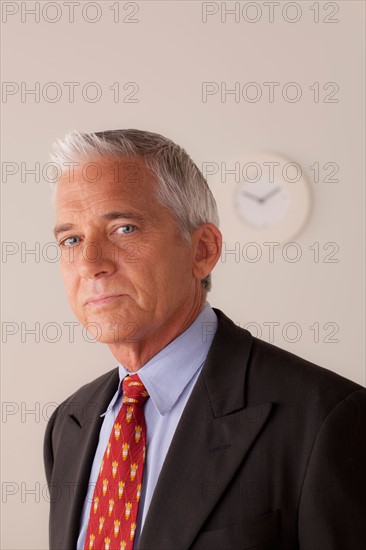 Studio portrait of senior businessman. Photo : Rob Lewine