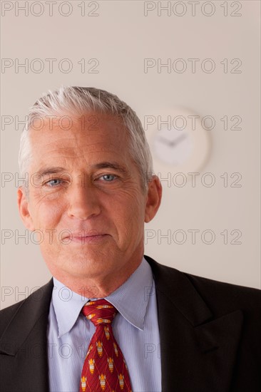 Studio portrait of senior businessman. Photo : Rob Lewine