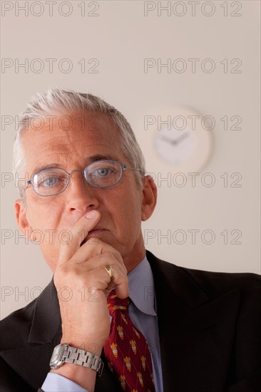 Studio portrait of senior businessman. Photo: Rob Lewine