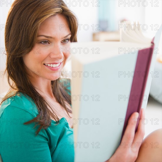 Woman reading book. Photo : Jamie Grill