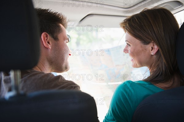 Couple sitting in car. Photo : Jamie Grill