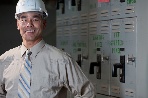 Portrait of male technician wearing hardhat. Photo : db2stock