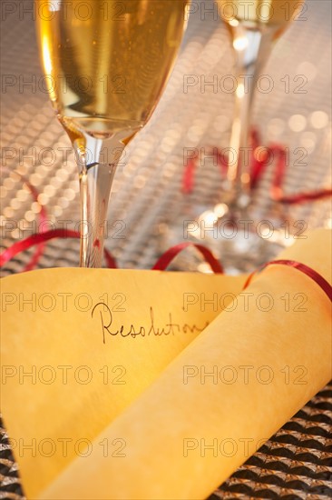 Flutes with champagne and list of resolutions. Photo : Daniel Grill