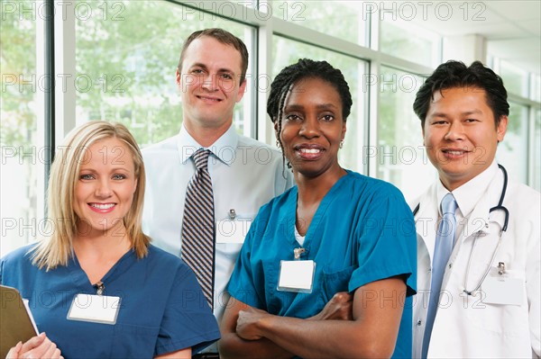 Doctor, hospital manager and two nurses posing for portrait. Photo: Erik Isakson