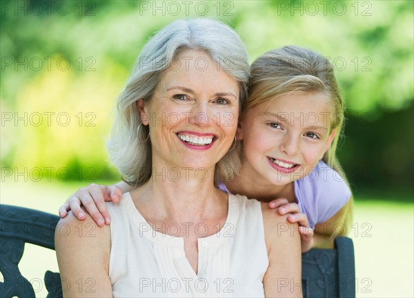 Portrait of grandmother with granddaughter (10-11) .