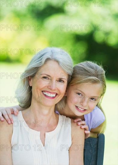 Portrait of grandmother with granddaughter (10-11) .