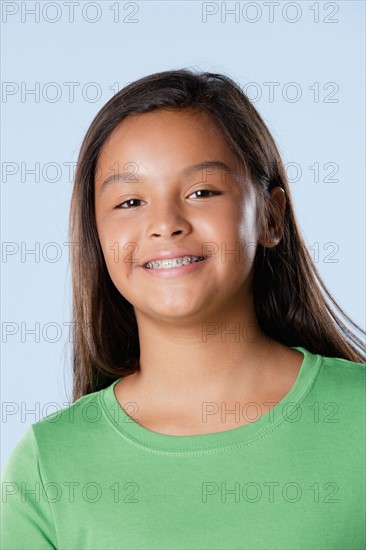 Studio portrait of girl smiling (10-11). Photo: Rob Lewine