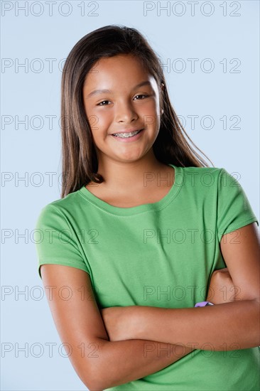 Studio portrait of girl smiling (10-11). Photo : Rob Lewine