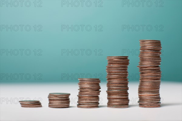 Studio shot of stacks of coins. Photo : Winslow Productions