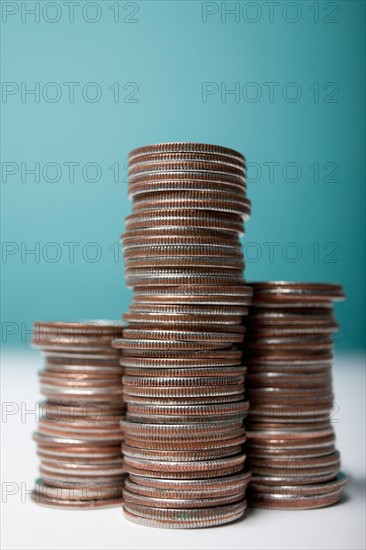 Studio shot of stacks of coins. Photo : Winslow Productions