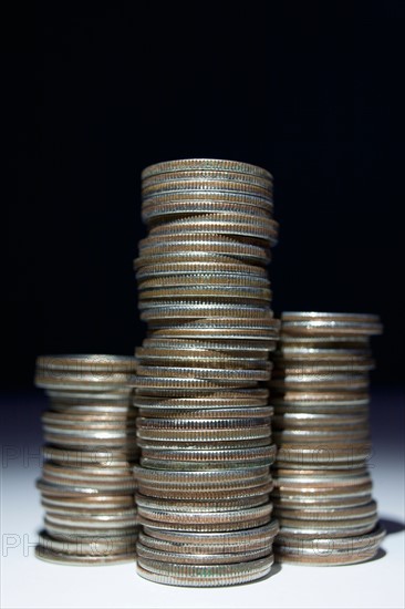 Studio shot of stacks of coins. Photo : Winslow Productions